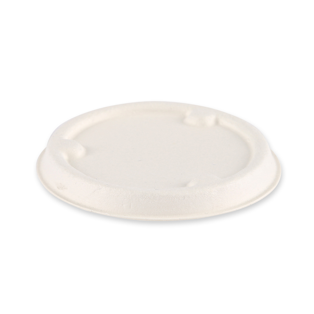 Organic lids for dressing cups made of bagasse, angled view