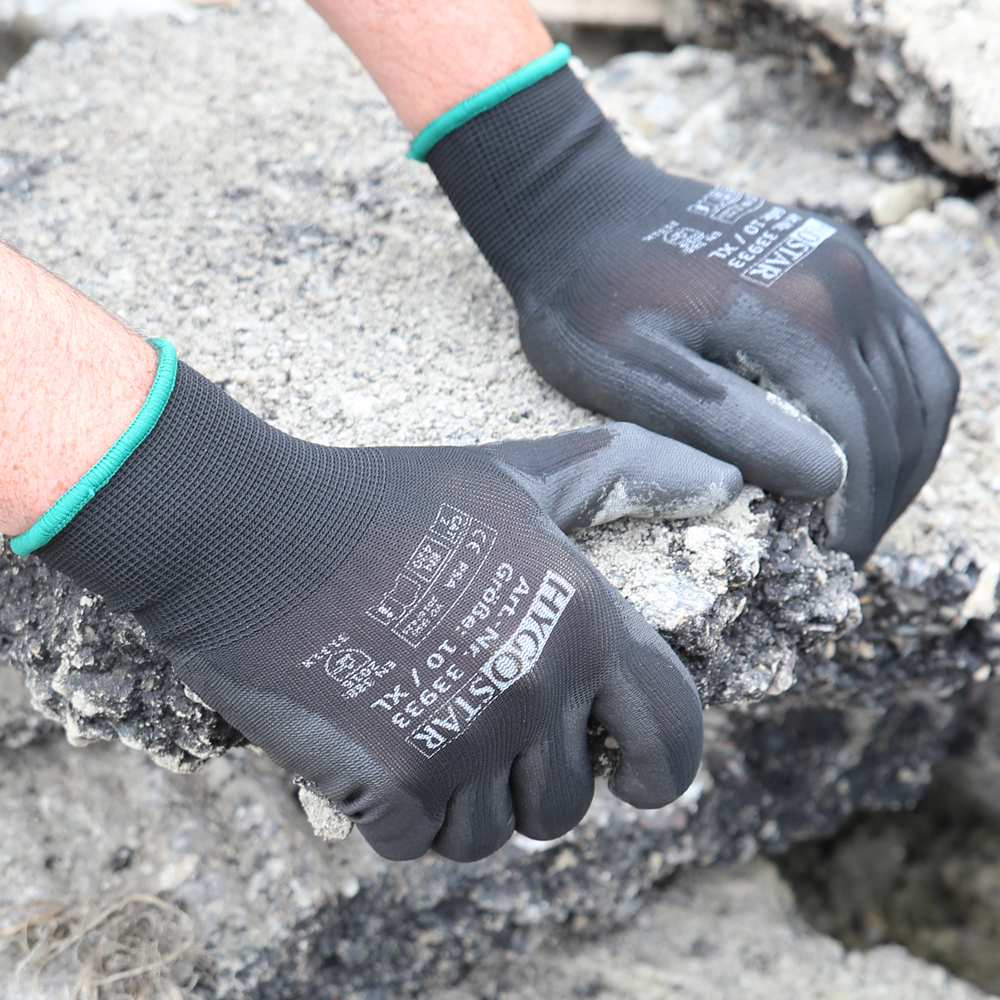 Fine knit gloves Black Ace with PU coating as application image for stone work