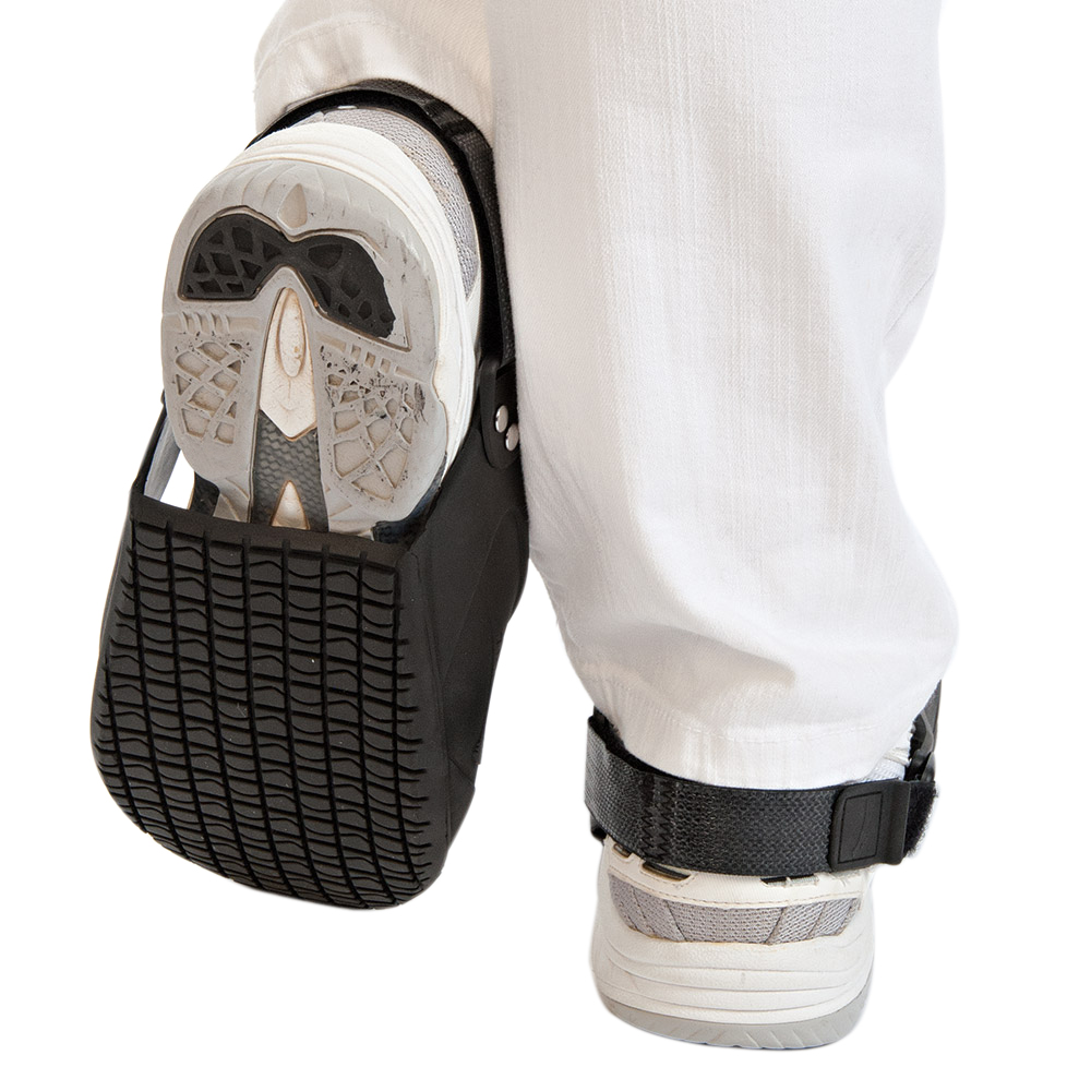 Safety overshoes with protective toe cap pulled over shoes